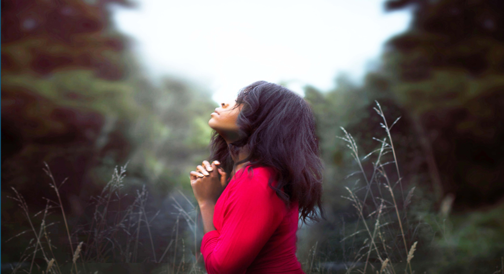 Girl praying asking the Lord to speak to her